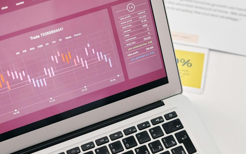 Laptop screen showing graphs and analytics reports